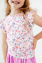 Mila & Rose whimsical woods short-sleeve ruffle tee for toddlers, featuring playful woodland print and ruffled sleeves.