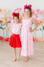 Pink ruffle tee for toddlers with sweet strawberry print from Mila & Rose, short-sleeve design for young children.