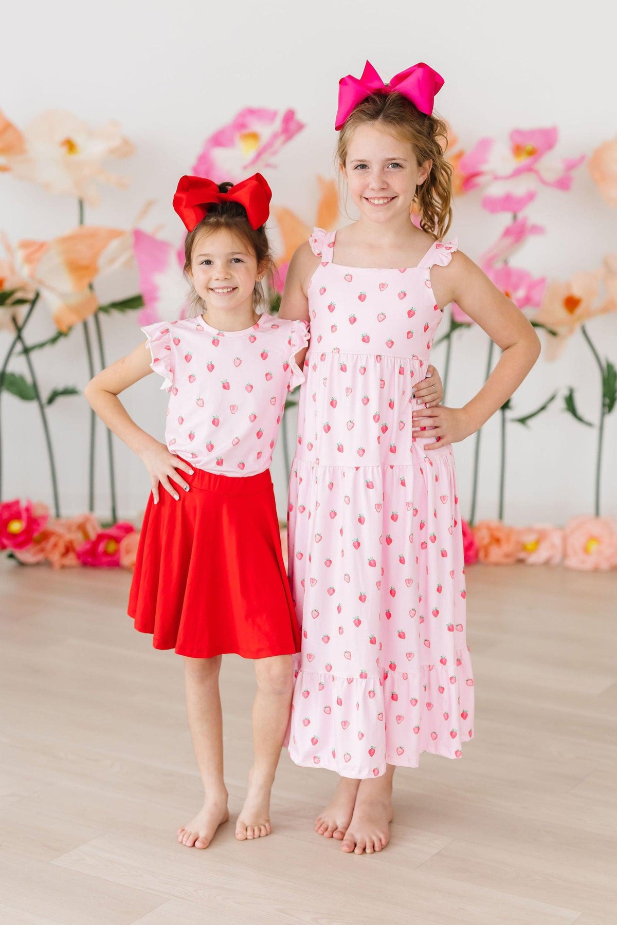Pink ruffle tee for toddlers with sweet strawberry print from Mila & Rose, short-sleeve design for young children.