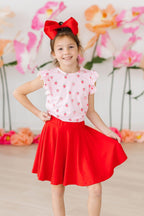 Mila & Rose sweet strawberry print short-sleeve ruffle tee for baby girls, featuring a charming strawberry pattern and ruffled sleeves.