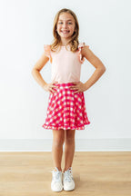 Hot pink gingham ruffle twirl skort for baby girls, by Mila & Rose, featuring playful ruffles and a fun, twirling design.