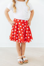 Red polka dot ruffle twirl skort for babies, by Mila & Rose, featuring a playful ruffled design and comfortable fit.