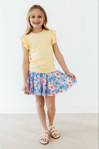 Watercolor floral ruffle twirl skort for girls in size 6-12 months by Mila & Rose, featuring a playful ruffle detail and vibrant floral print.