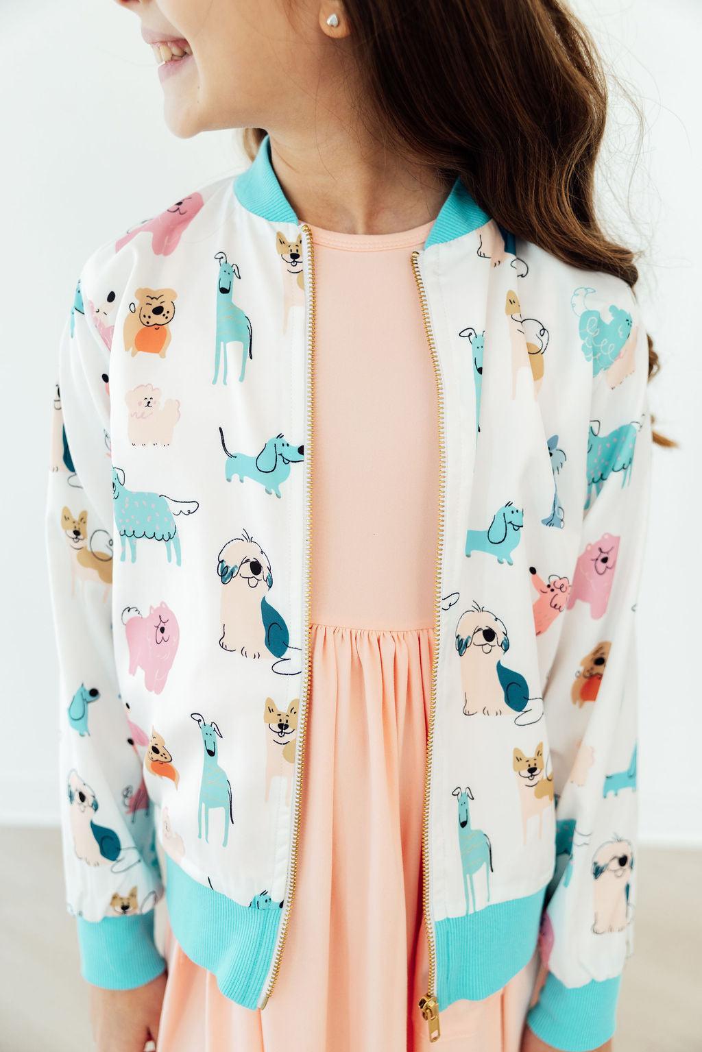 Pink Mila & Rose Puppy Pals satin jacket for toddlers, featuring cute puppy designs and soft shiny fabric.
