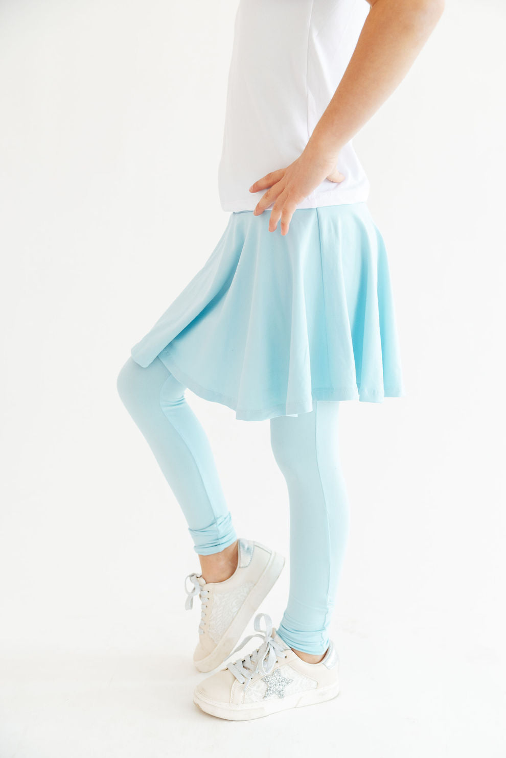 Blue Mila & Rose ® Bluebird Twirl Skegging, stylish stretch leggings with a colorful bird pattern, close-up view of fabric detail.