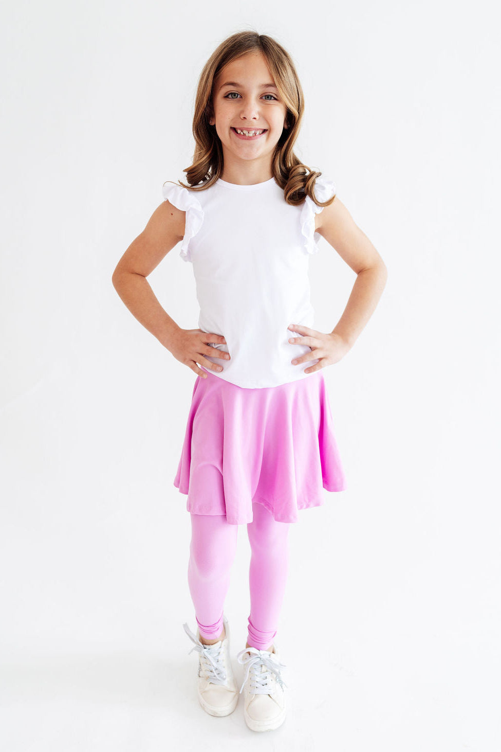Bright lilac Mila & Rose skegging with a twirl pattern, form-fitting and stretchy for comfortable active wear.