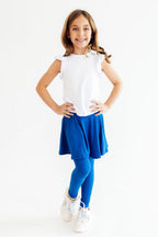 Royal blue Mila & Rose® skegging with a twirl pattern, form-fitting leggings for active wear, shown on a model.