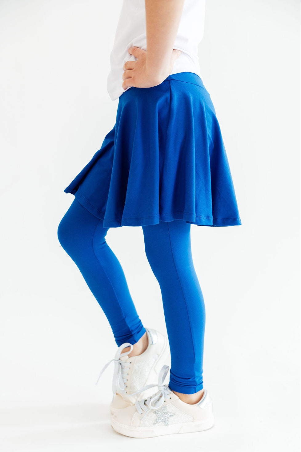 Royal blue Mila & Rose ® Twirl Skegging, stretchy women's leggings with a vibrant twirl pattern, shown on a model.
