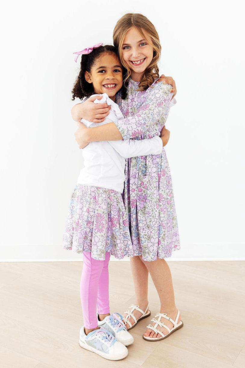 Mila & Rose Spring Gardens Twirl Skegging in vibrant floral print, stretchy fabric, close-up of the colorful patterned leggings.