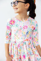 Mila & Rose Field of Flowers 3/4 Sleeve Pocket Twirl Dress for girls, featuring a floral pattern, pockets, and a twirl skirt design.