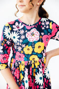 Mila & Rose midnight floral 3/4 sleeve pocket twirl dress for girls, featuring a playful floral pattern and comfortable dress design.