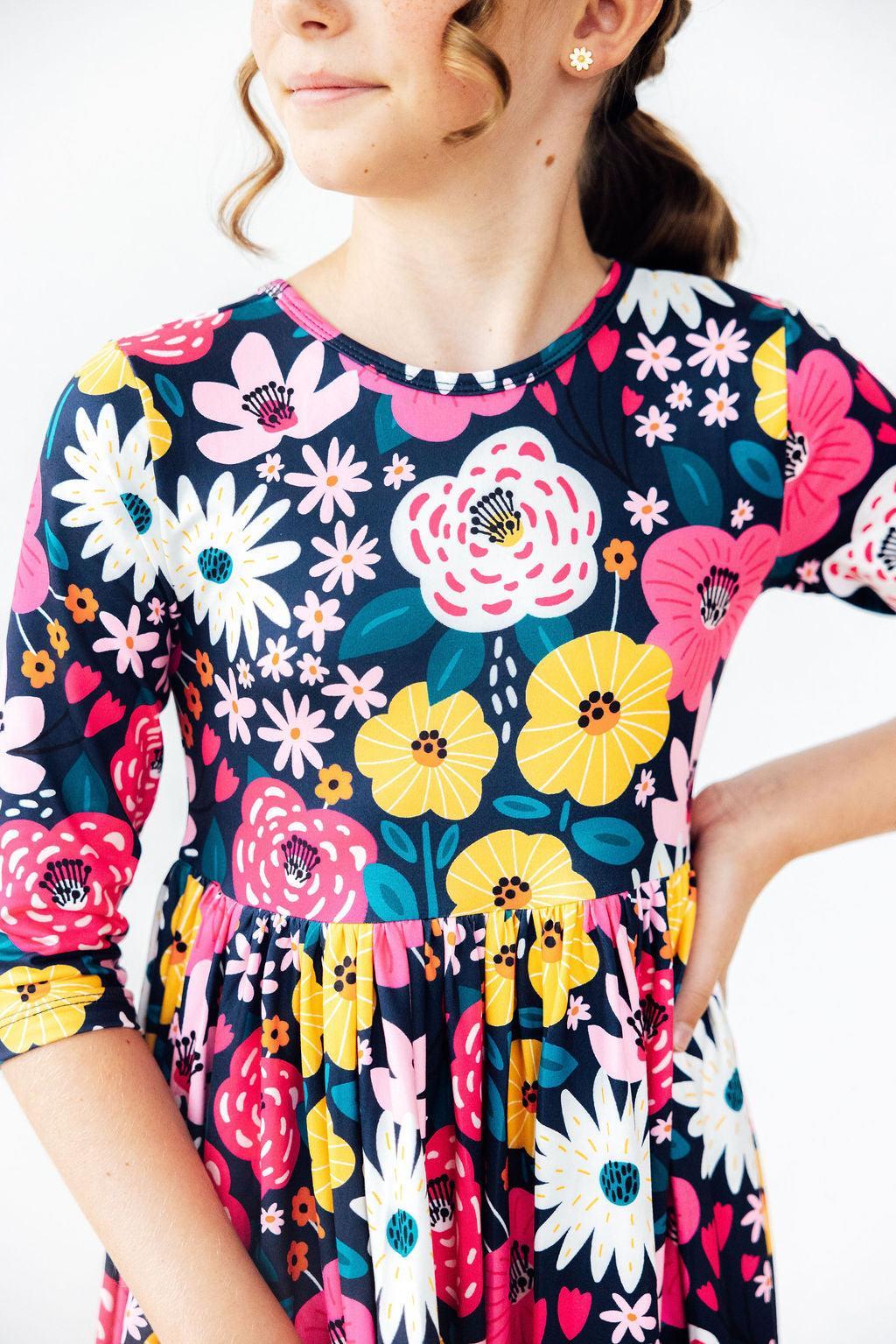 Mila & Rose midnight floral 3/4 sleeve pocket twirl dress for girls, featuring a playful floral pattern and comfortable dress design.