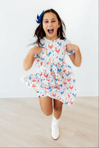 Mila & Rose rainbow rooster print S/S pocket twirl dress for girls, featuring colorful pattern and comfortable design.