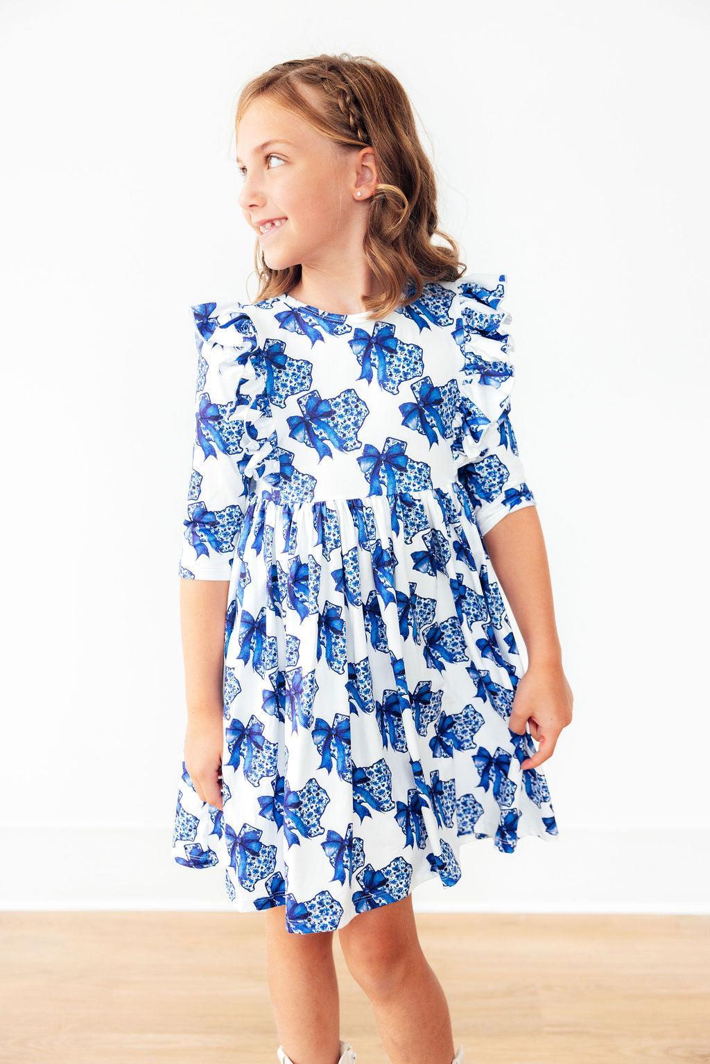 Mila & Rose Lone Star 3/4 Sleeve Ruffle Twirl Dress for infants, featuring ruffle details and a playful twirl design.