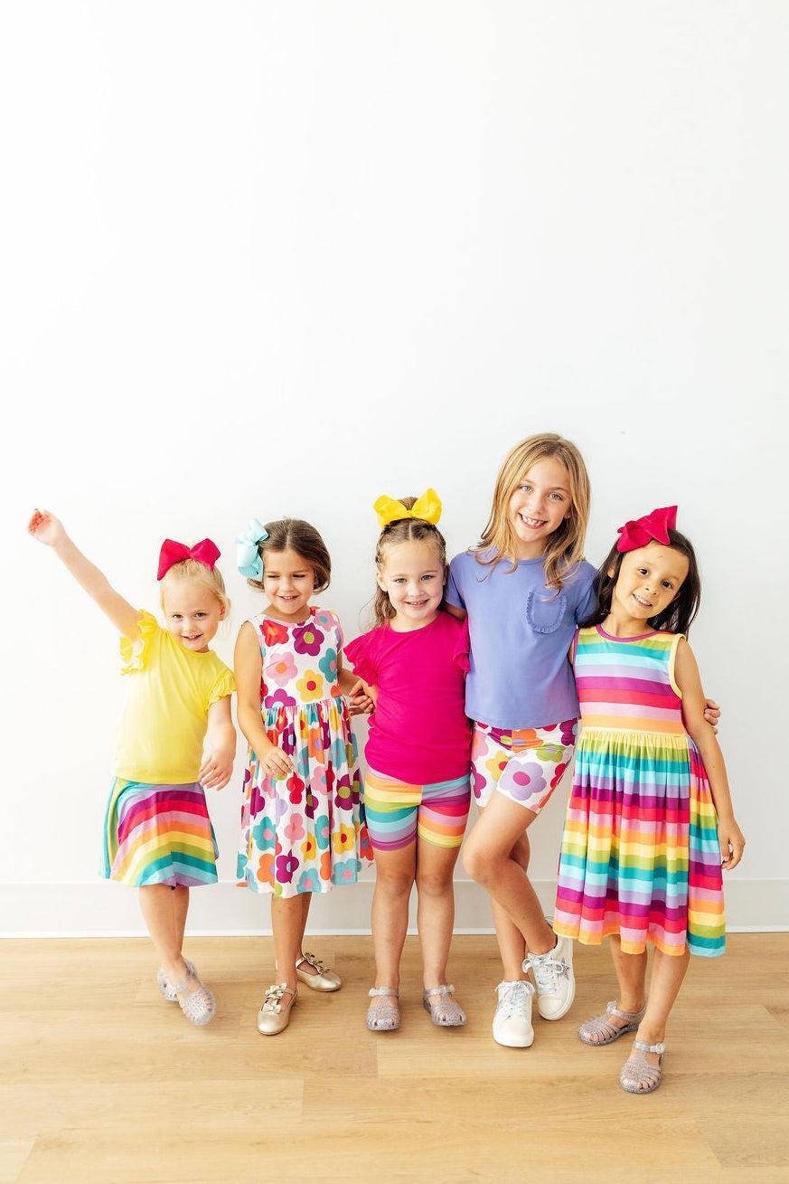 Mila & Rose® Cheerful Stripes Twirl Shorts for toddlers in bright rainbow colors, made of soft fabric, perfect for playful days.