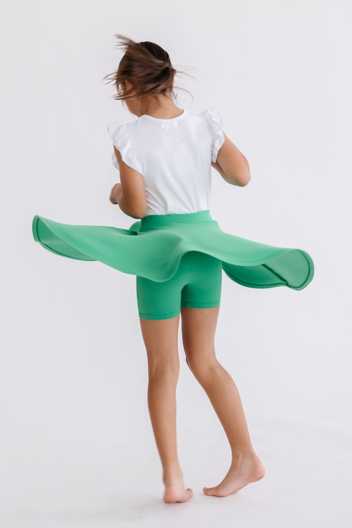 Kelly green Mila & Rose twirl skort for toddlers, featuring a playful ruffled design and comfortable elastic waistband.