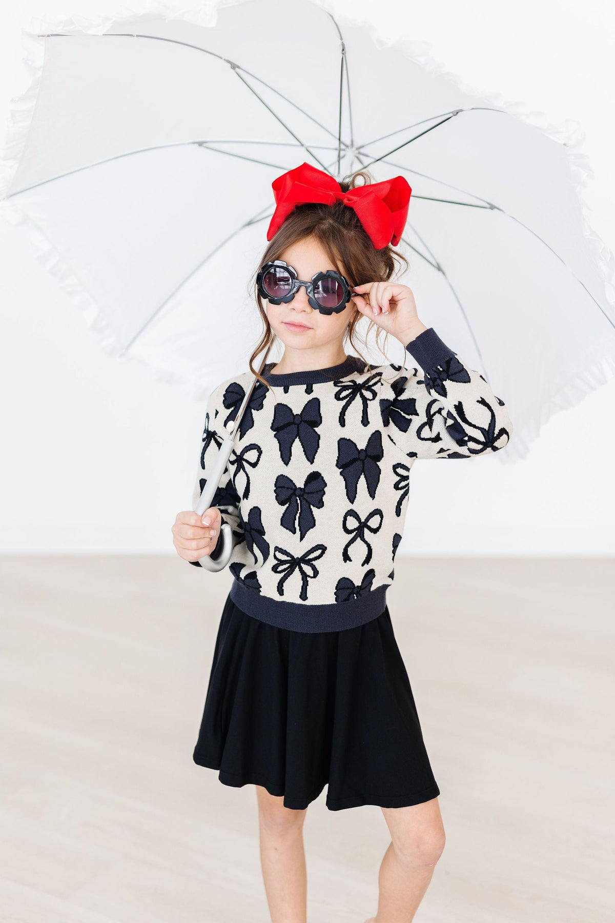 Black Mila & Rose twirl skort for girls aged 6-12 months, featuring a playful twirl design and comfortable fabric.