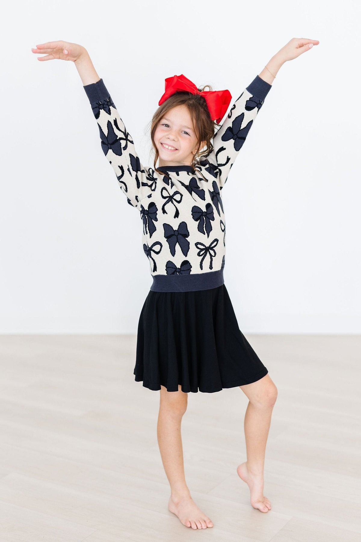 Black Mila & Rose twirl skort for girls aged 6-12 months, featuring a playful twirl design and comfortable fabric.