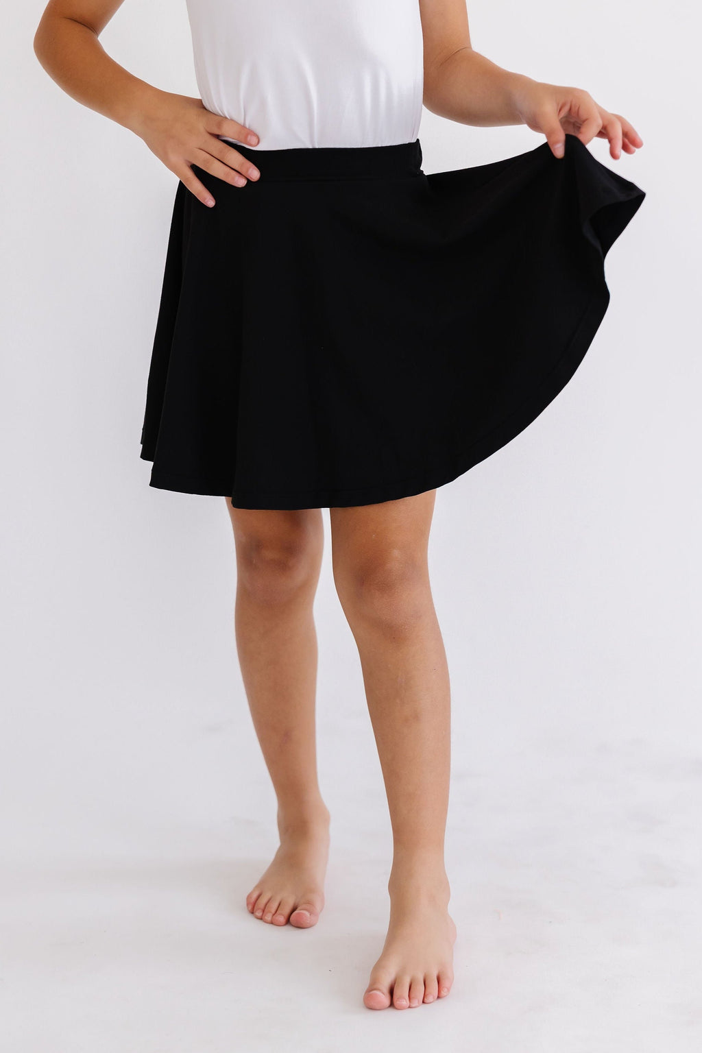 Black Mila & Rose twirl skort for girls, featuring a playful, swirling design and comfortable fit for ages 6-12 months.