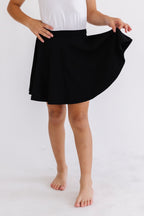 Black Mila & Rose twirl skort for girls, featuring a playful, swirling design and comfortable fit for ages 6-12 months.