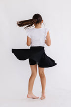 Black Mila & Rose twirl skort for girls, featuring a playful design and comfortable fabric, perfect for active wear.