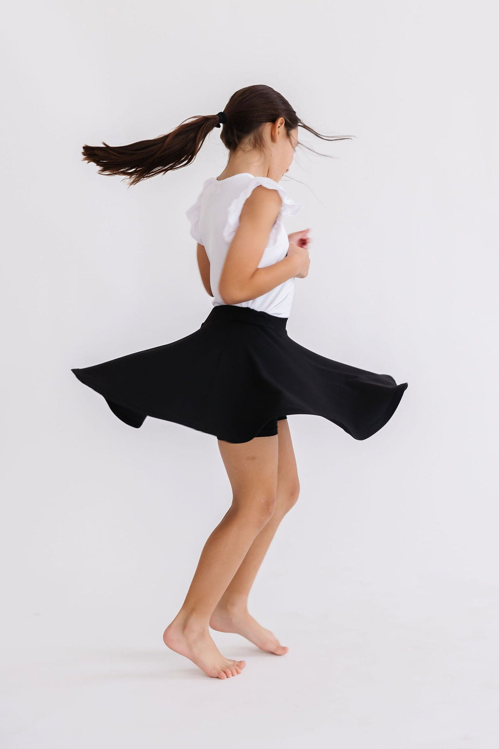 Black Mila & Rose Twirl Skort for girls, featuring a playful twirl design and comfortable fit for children aged 6-12 months.