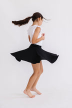 Black Mila & Rose Twirl Skort for girls, featuring a playful twirl design and comfortable fit for children aged 6-12 months.