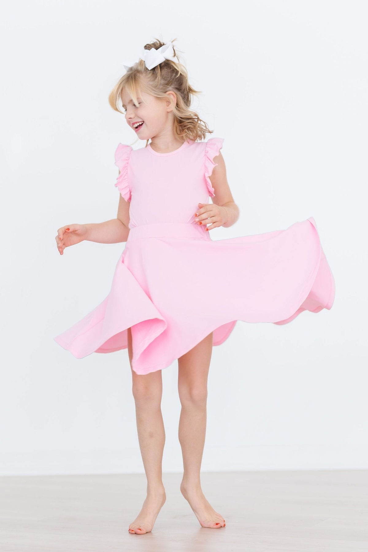 Bubblegum pink twirl skort by Mila & Rose for 6-12 months, featuring a playful ruffled design and comfortable fit.