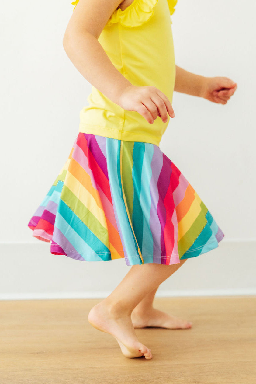Mila & Rose cheerful stripes twirl skort for toddlers, featuring colorful striped fabric and a playful, twirling design.