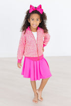 Hot pink Mila & Rose twirl skort for girls aged 6-12 months, featuring a playful, ruffled design and comfortable elastic waistband.