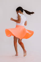 Neon coral Mila & Rose twirl skort for 6-12 months, featuring a playful ruffled design and comfortable fabric.