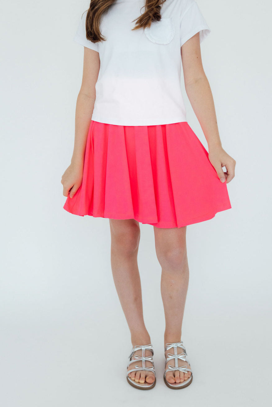 Neon pink Mila & Rose twirl skort for 6-12 months, with a playful swirl pattern and comfortable elastic waistband.