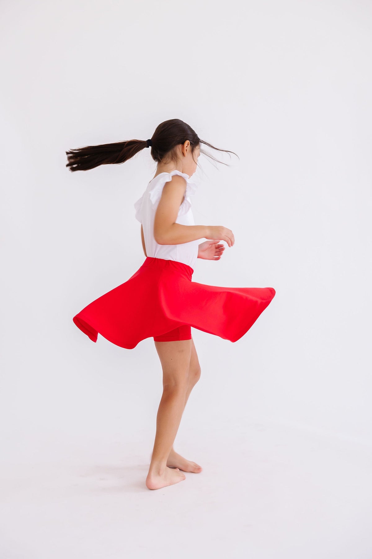 Red Mila & Rose twirl skort for girls, featuring a playful design and comfortable fabric perfect for active wear and casual outings.