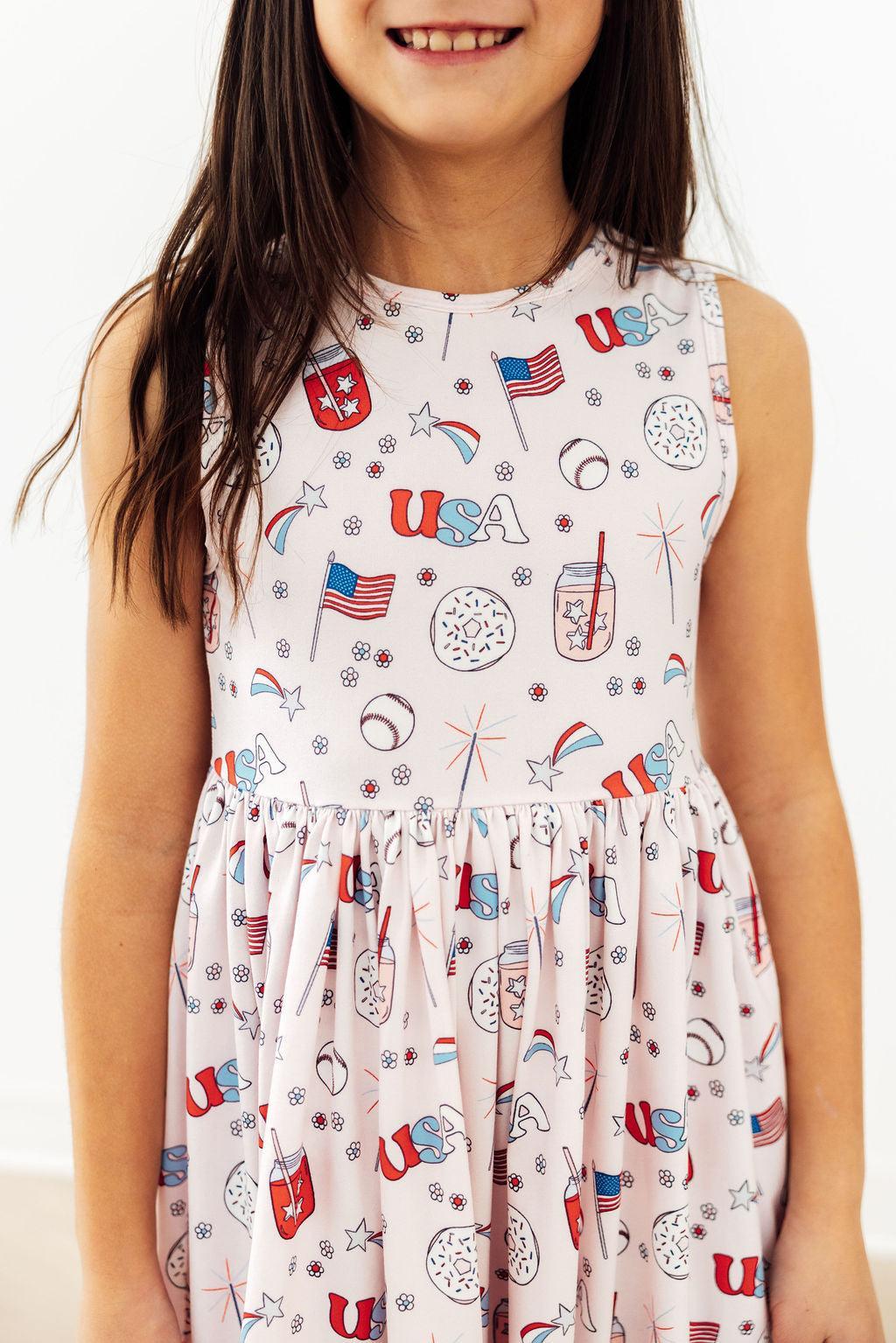 Mila & Rose Born in the USA Twirl Tank Dress for babies, pink and white fabric, perfect for warm weather and playful twirls.