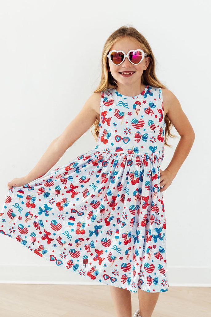 Little Miss Liberty Twirl Tank Dress by Mila & Rose for 6-12 months, featuring colorful fabric and playful design.
