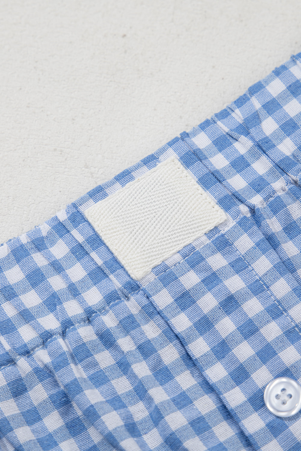 Red gingham printed high waist shorts from Mommas Hive, casual polyester bottoms with a fitted waist and stylish design.