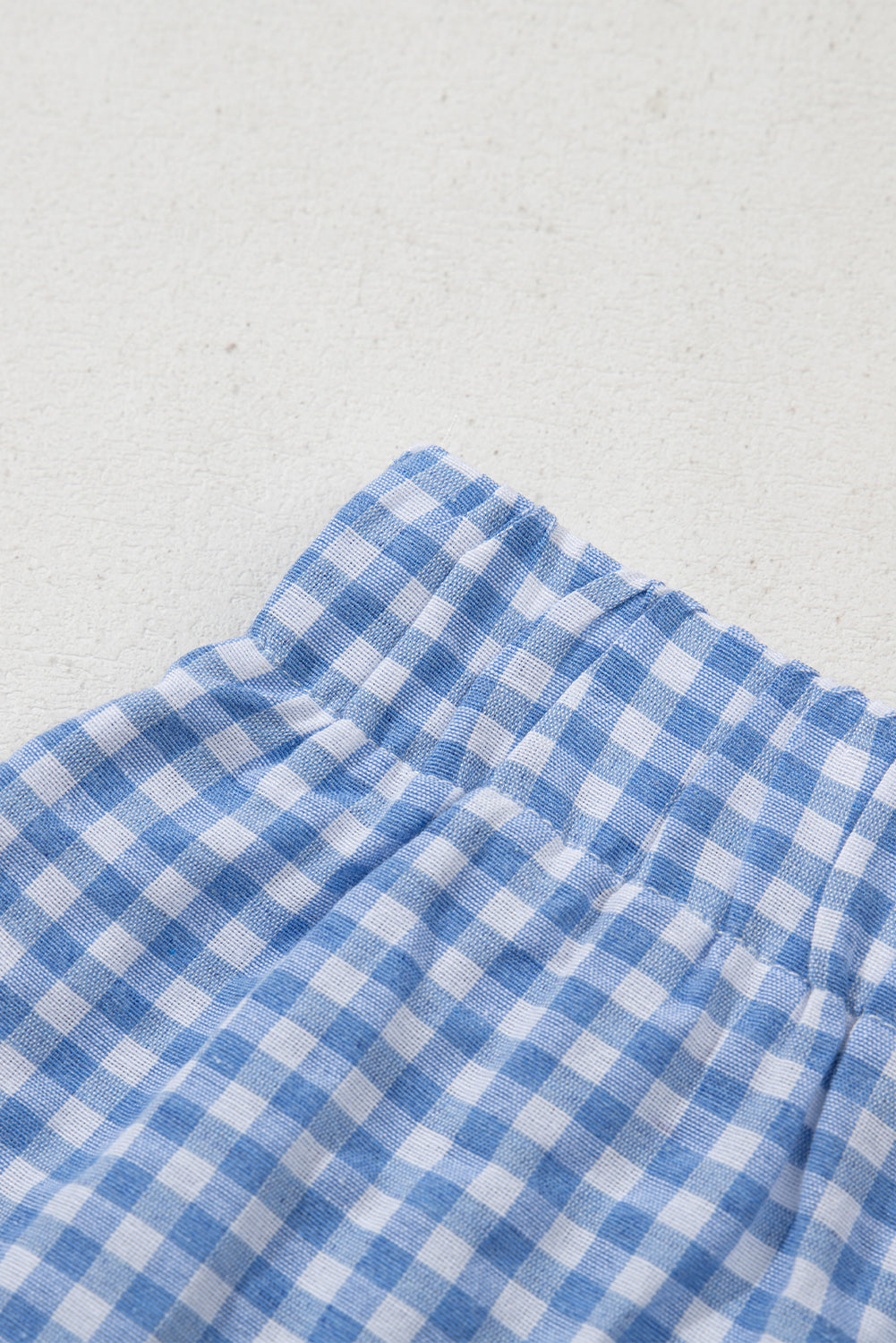 Red gingham printed high waist casual shorts from Mommas Hive, made of polyester, shown on a model.