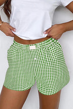 Red gingham printed high waist casual shorts by Mommas Hive, featuring a relaxed fit and front pockets.