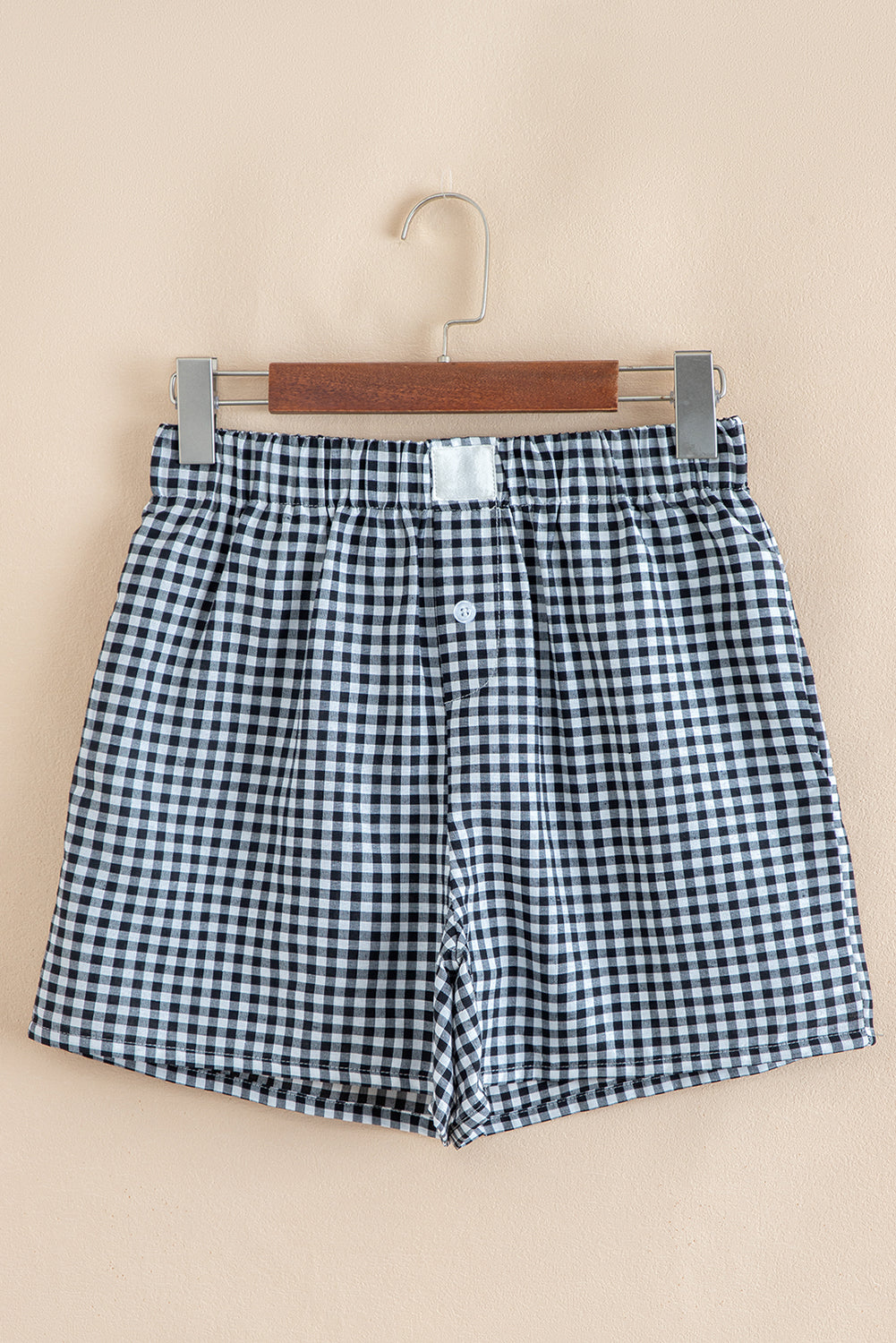 Red gingham printed high waist casual shorts for women, made of polyester, by Mommas Hive, shown laid flat with waistband visible.