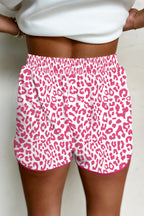 Pink leopard print casual shorts with elastic waist, contrast trim, lace-up front, made by Mommas Hive.