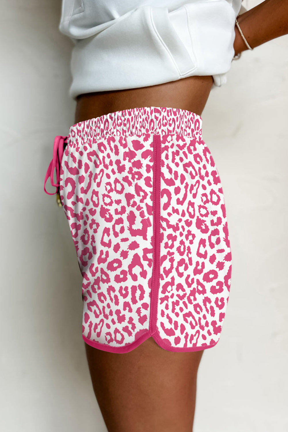 Pink leopard print casual shorts with elastic waist, lace-up detail, contrast trim, made by Mommas Hive.