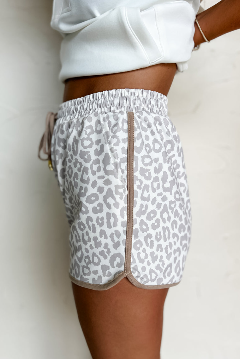Pink leopard print casual shorts with elastic waistband, lace-up front, contrast trim, made by Mommas Hive.