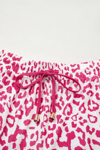 Pink leopard print casual shorts with elastic waist, contrast trim, lace-up front, made by Mommas Hive.