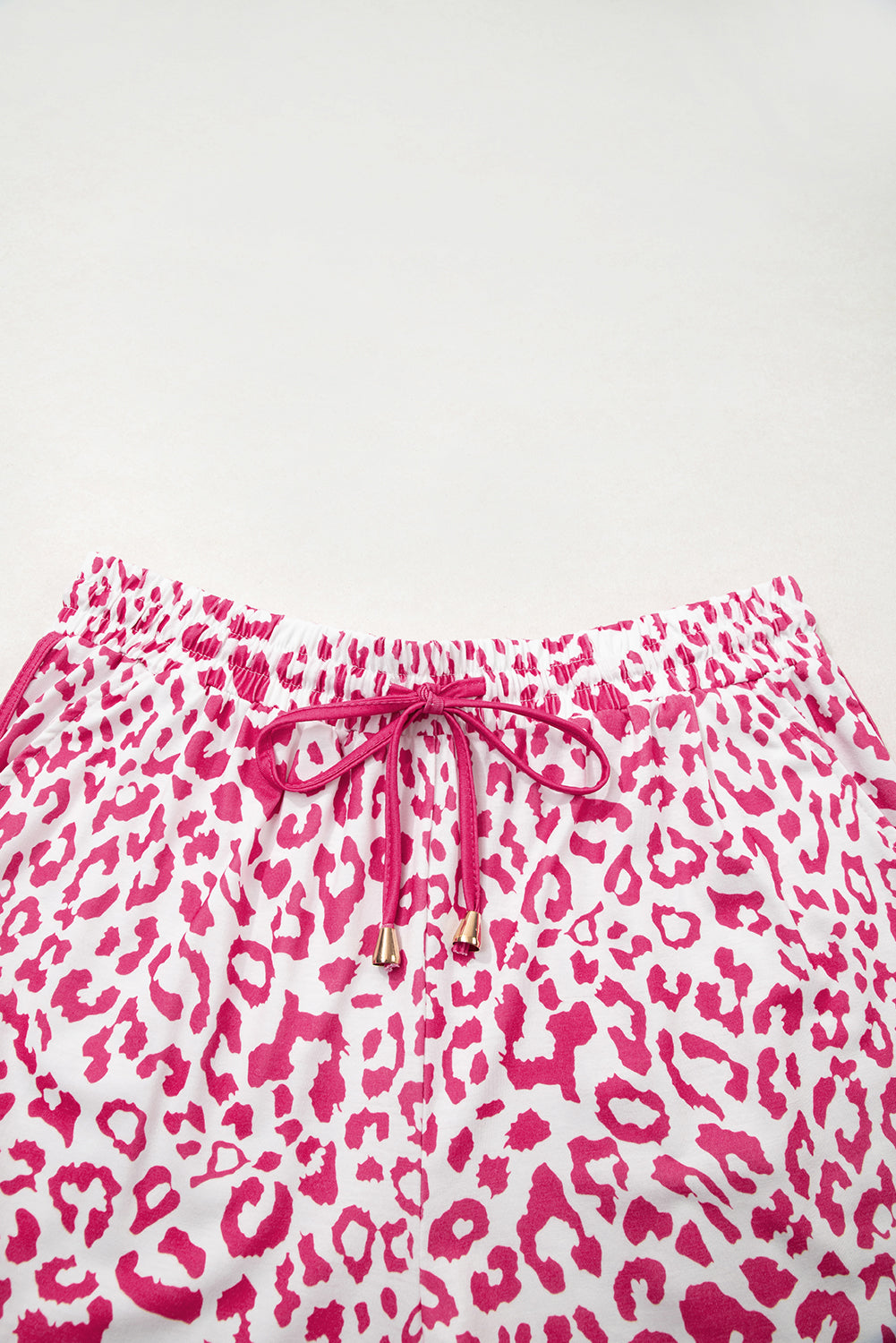 Pink leopard print casual shorts with elastic waist, lace-up front, contrast trim, made by Mommas Hive.