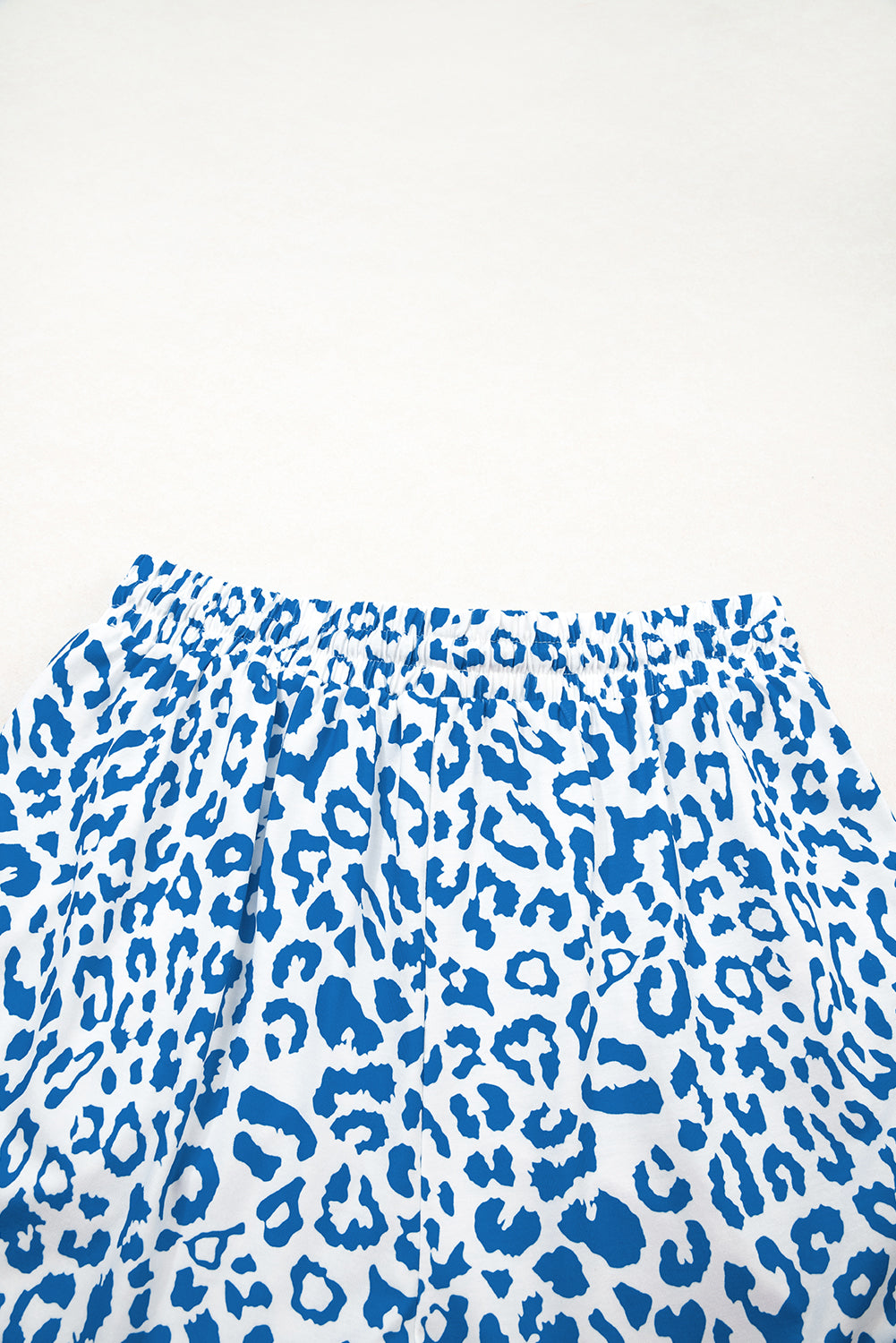 Pink leopard print casual shorts with elastic waist, lace-up front, and contrast trim, made by Mommas Hive.