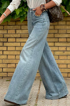 Dusk blue acid wash extra wide leg high waist long jeans by Mommas Hive, showcasing the relaxed fit and stylish design.