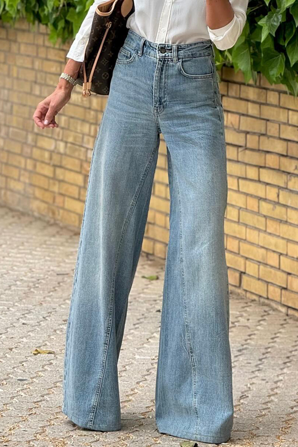 Dusk blue acid wash extra wide leg high waist long jeans by Mommas Hive, showing the relaxed fit and stylish design.