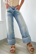 Mommas Hive Myosotis high-rise medium wash jeans with button and zip fly, made of cotton, polyester, and elastane for a comfortable fit.