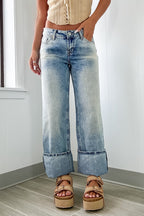 Myosotis high-rise jeans by Mommas Hive featuring button and zip fly, medium wash denim, with cotton, polyester, and elastane blend.