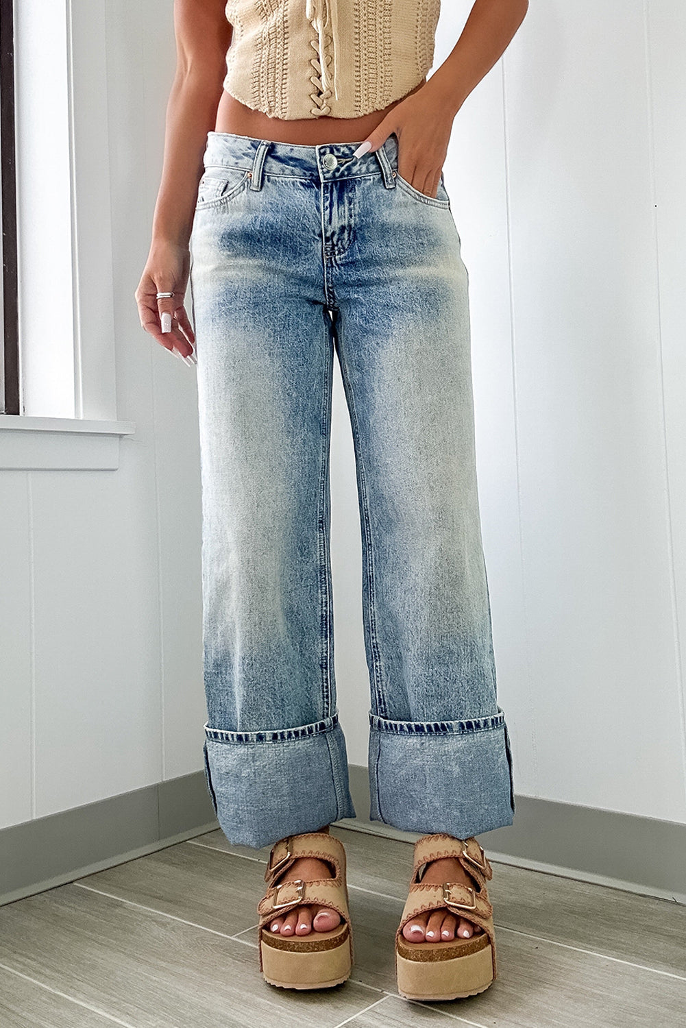 Myosotis high-rise jeans by Mommas Hive featuring button and zip fly, medium wash denim, with cotton, polyester, and elastane blend.
